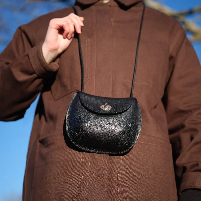 Suede Shoulder Bag in Pink with Tassel Accents for Casual OutingsBlack Owl Bag